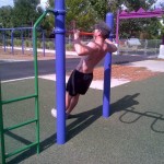 Standing body weight row. Not as difficult as laying flat, but works upper back, lats and rear deltoids.