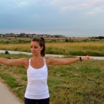 Arm circles! Stand with arms extended by the sides, perpendicular to the torso. Slowly make clockwise circles for about twenty to thirty seconds (about one foot in diameter). Then reverse the movement, going counter-clockwise.