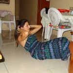 Basic sit-up. Maria lays down and keeps core engaged. Lock feet in and sit back and up. Pic taken in Mochudi, Botswana. You really can workout anywhere!