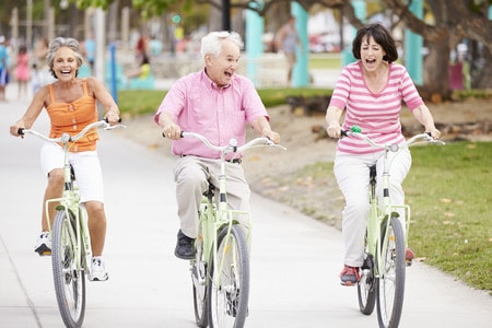 42314787 - group of senior friends having fun on bicycle ride