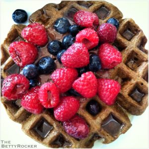 Dollop of Nutella in the center, fresh blueberries and raspberries then a drizzle of maple syrup.