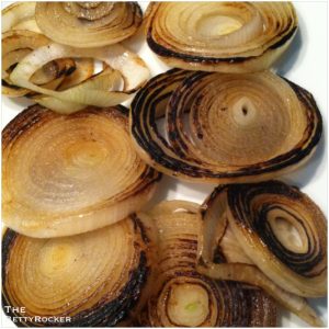 2. While the eggplant is baking, grill or pan sear your onion slices until crispy and translucent.